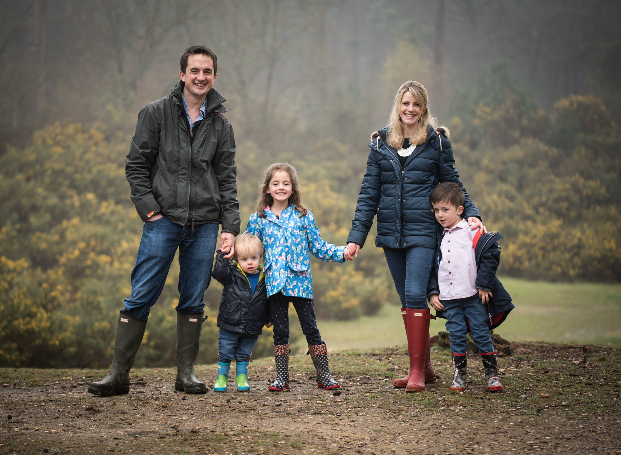 Family posing in woodland during family photoshoot in Benson Wallingford